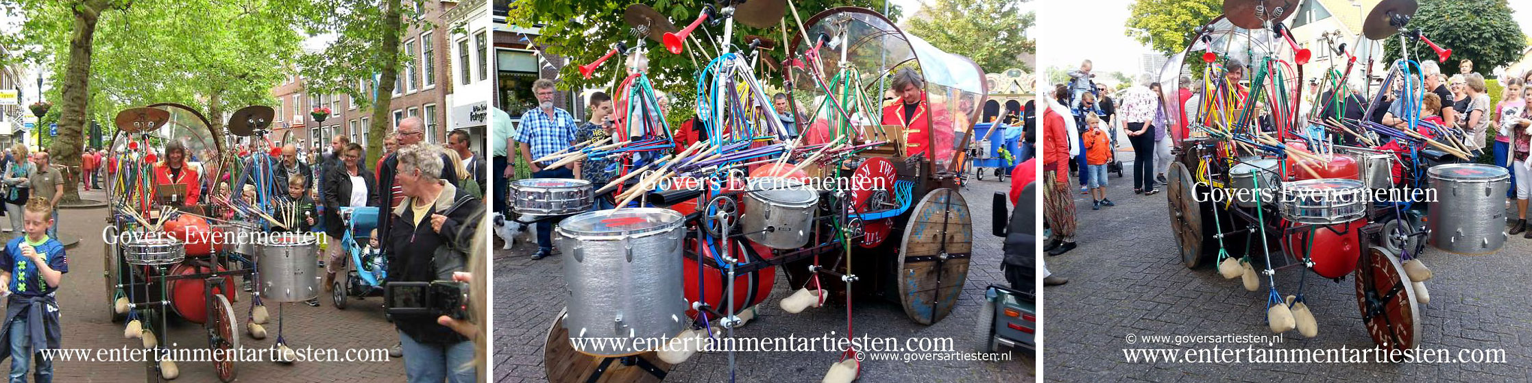 Straatact, muziek, bandje, straatmuziek, Straattheater, Het rollende object Uit het land waar roest nooit rust en afval niet bestaat komt klompengeklos, een drumband met houten klompen als loopmachine, www.goversartiesten.nl